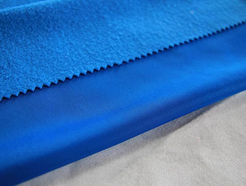 What factors need to be considered when choosing garment fabrics?